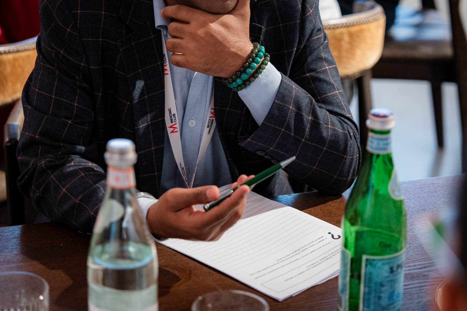 Corporate attendee taking notes during modern slavery conference