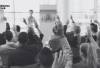 Group of members raising hands at Working Group Meeting